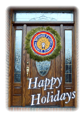 Door with wreath wishing happy holidays.